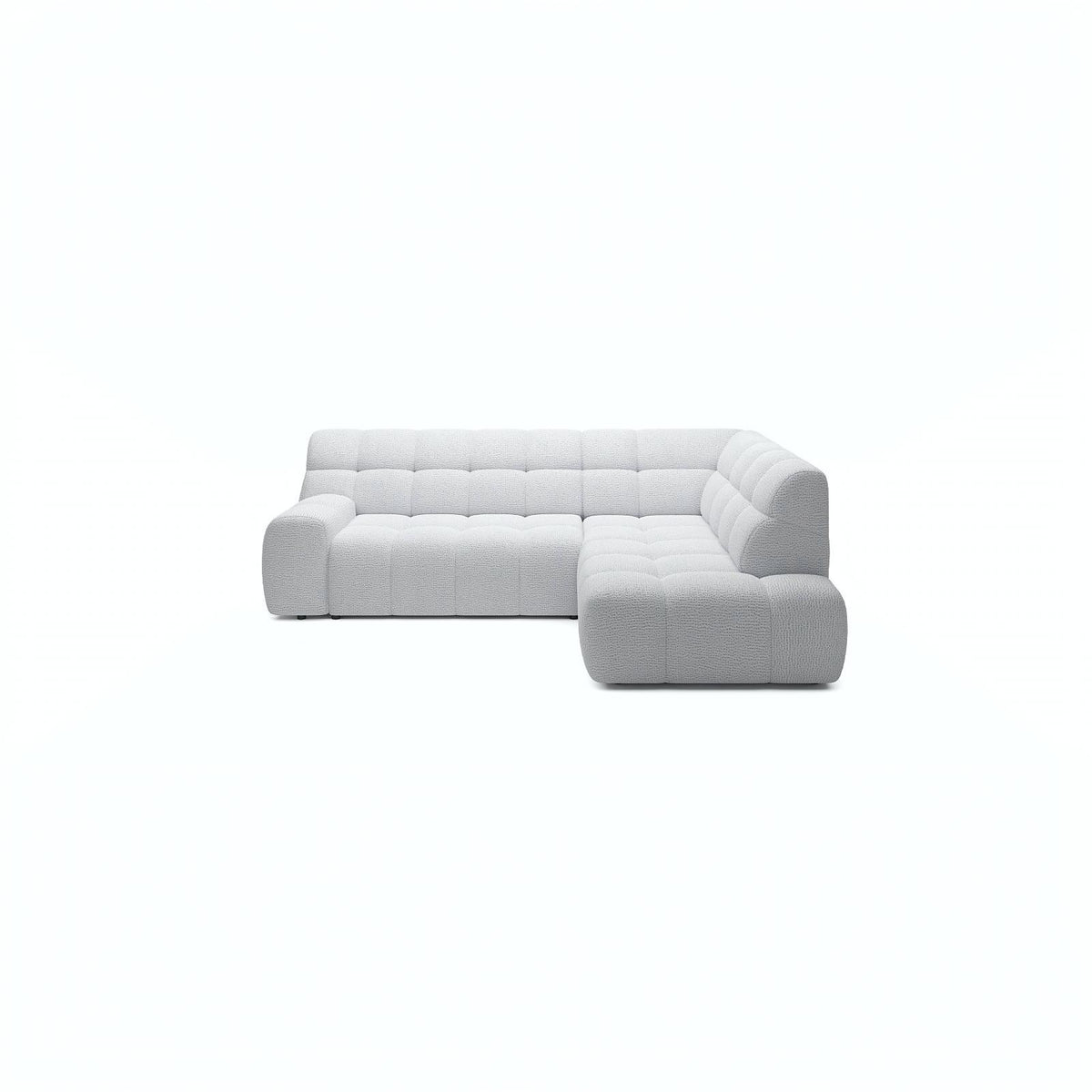 A light gray tufted modular sectional sofa with a right-facing chaise lounge, shown from a front-facing perspective against a solid white background.