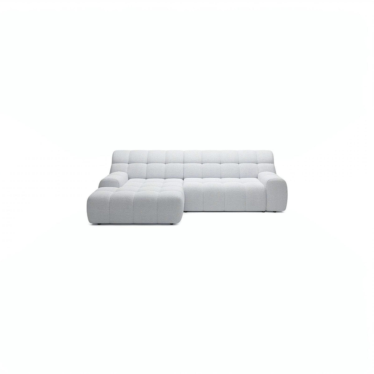 A modern light gray tufted sectional sofa with a left-facing chaise lounge, shown against a solid white background.