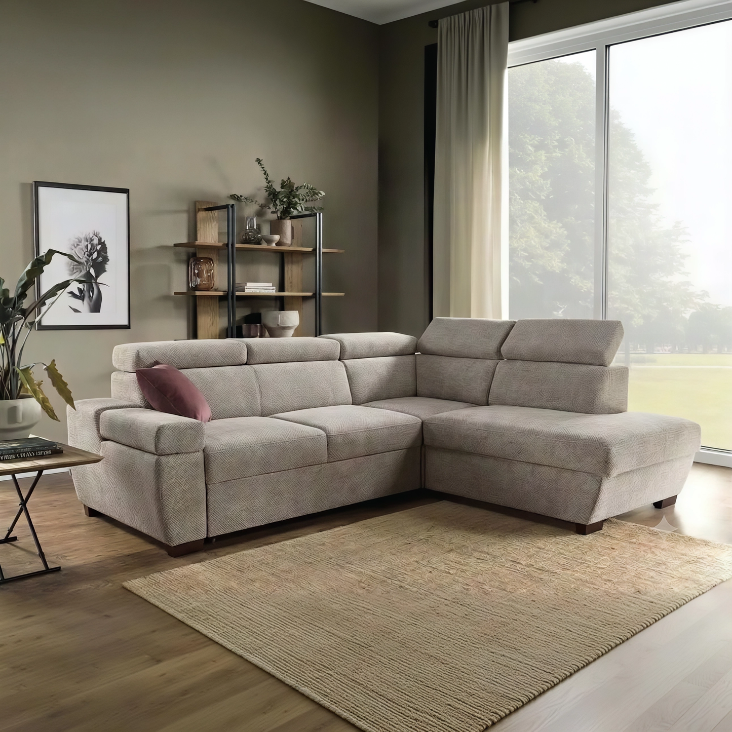 A beige fabric sectional sofa with a right-facing chaise lounge, styled in a modern living room with a brown rug, wooden floor, and a large window.